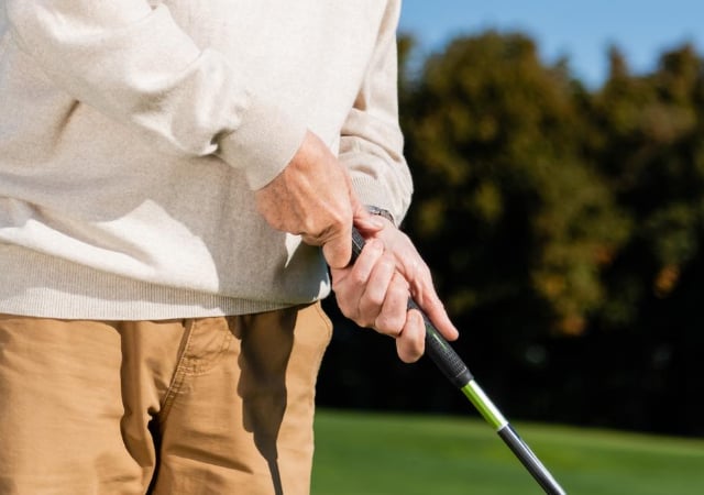 Golfer showing his grip on the golf club