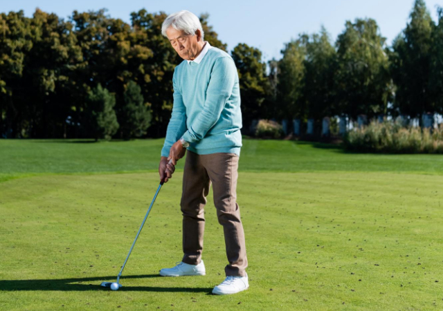 Golfer preparing to take his shot on the golf course