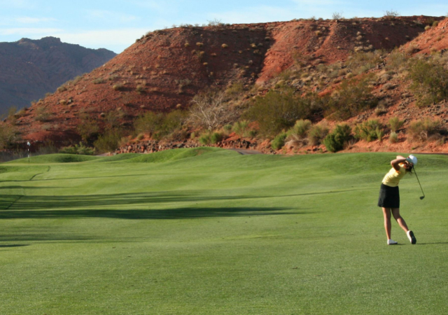 golfer taking a shot for the golf ball