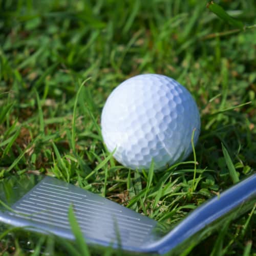 hitting the golf ball with iron